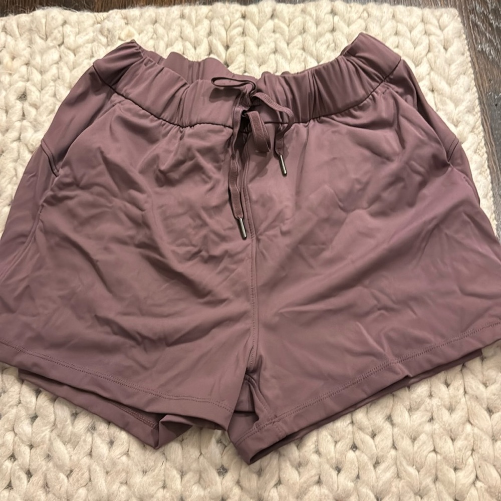 Brand, new, purple, eggplant, running shorts with pockets and tag still on them